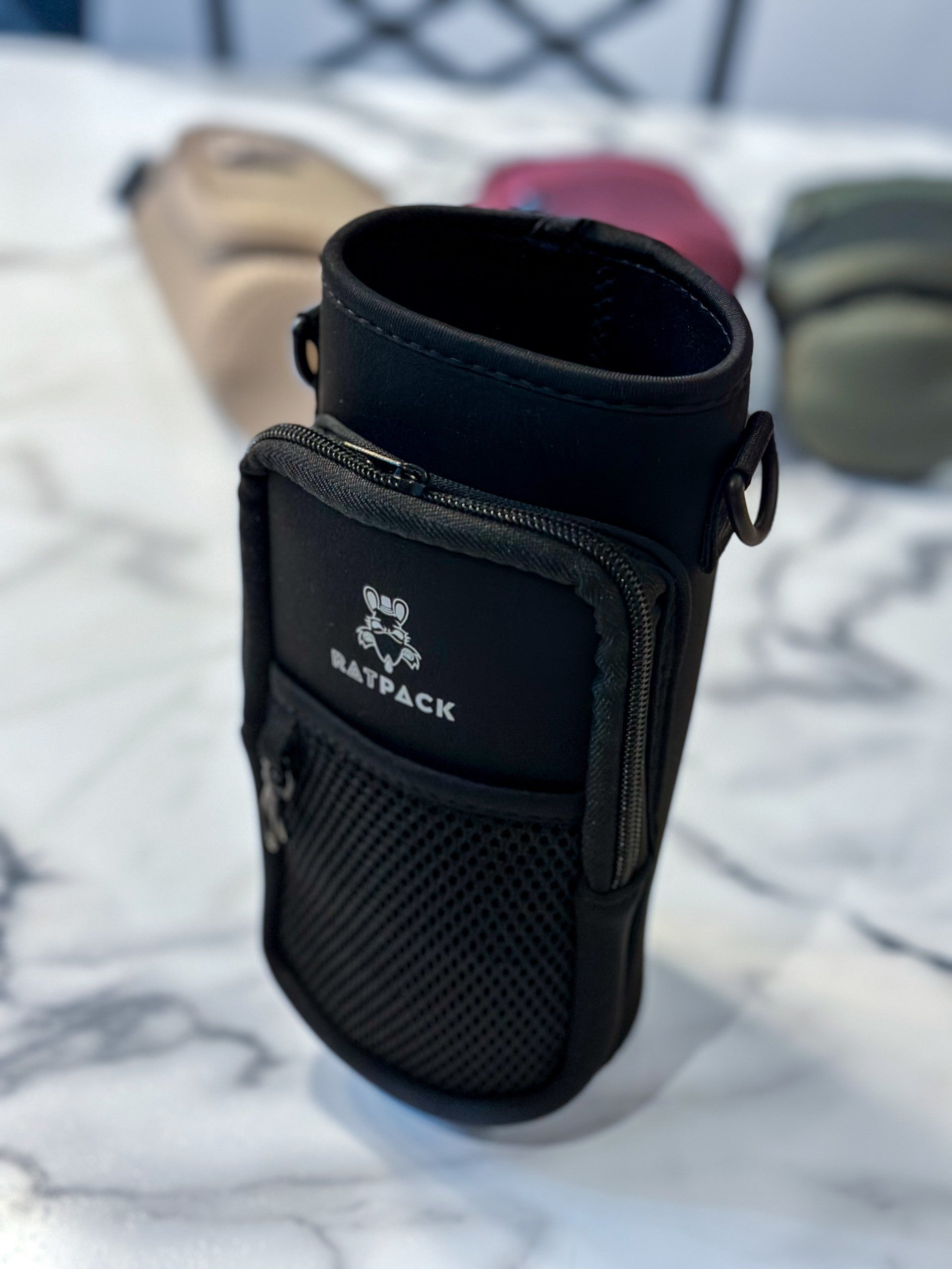 40 ounce/ 1.3 Liter water bottle sleeve insulated cross body carrier with pockets for phone and essentials, built in key chain black