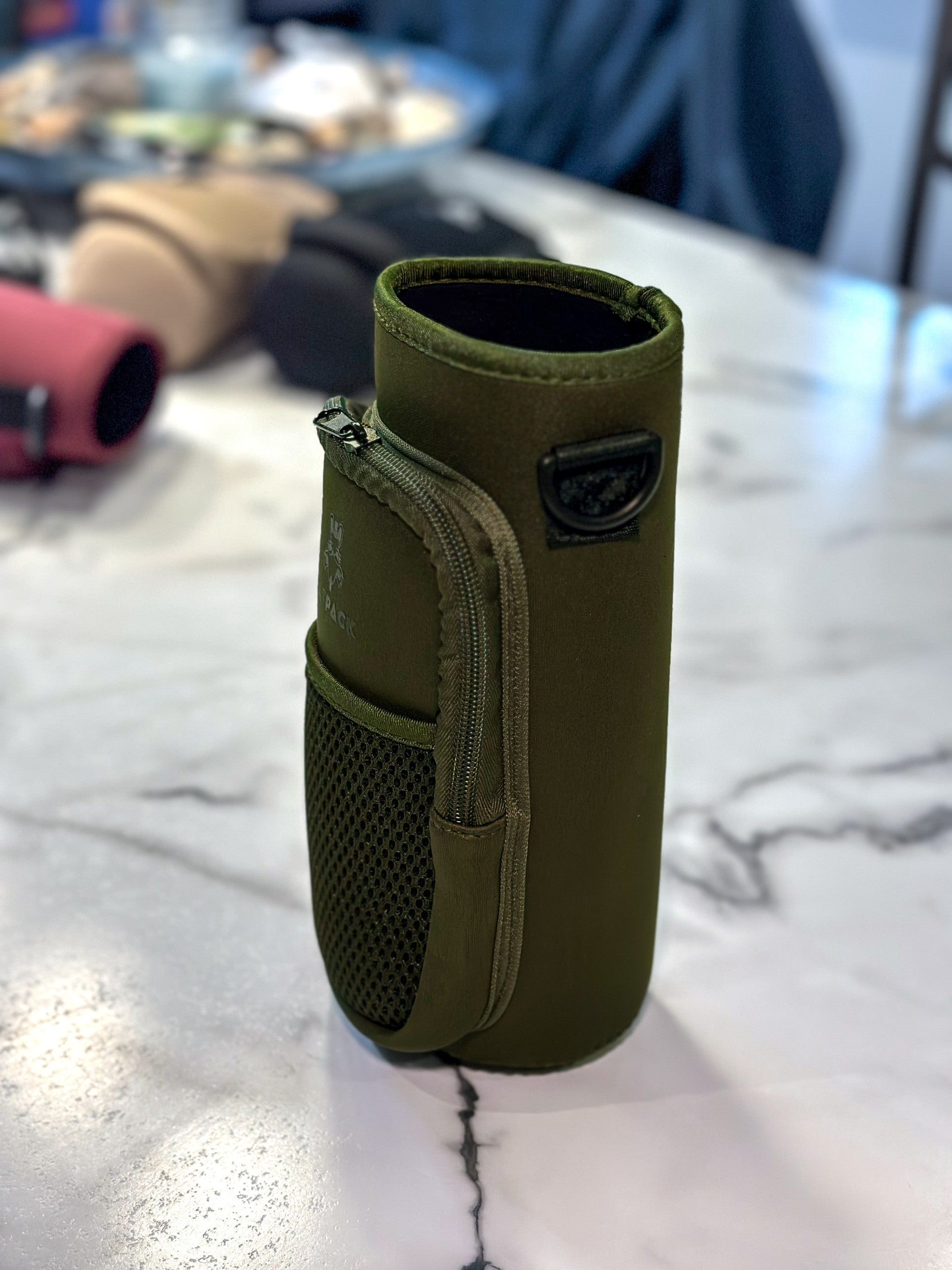 40 ounce/ 1.3 Liter water bottle sleeve insulated cross body carrier with pockets for phone and essentials, built in key chain army green